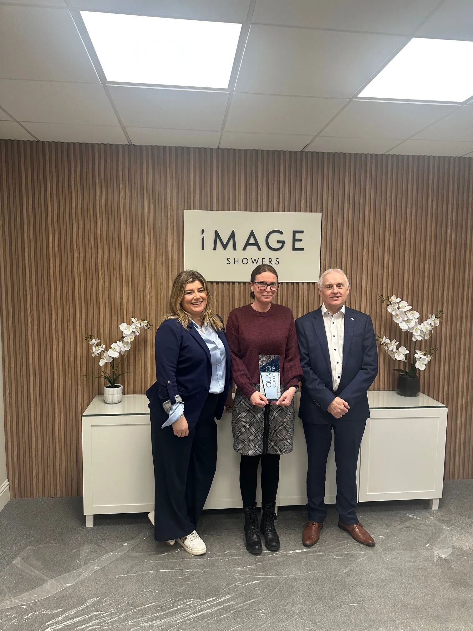 Image Showers receiving ISO 9001 Quality Management Certification certification from Paula Brady