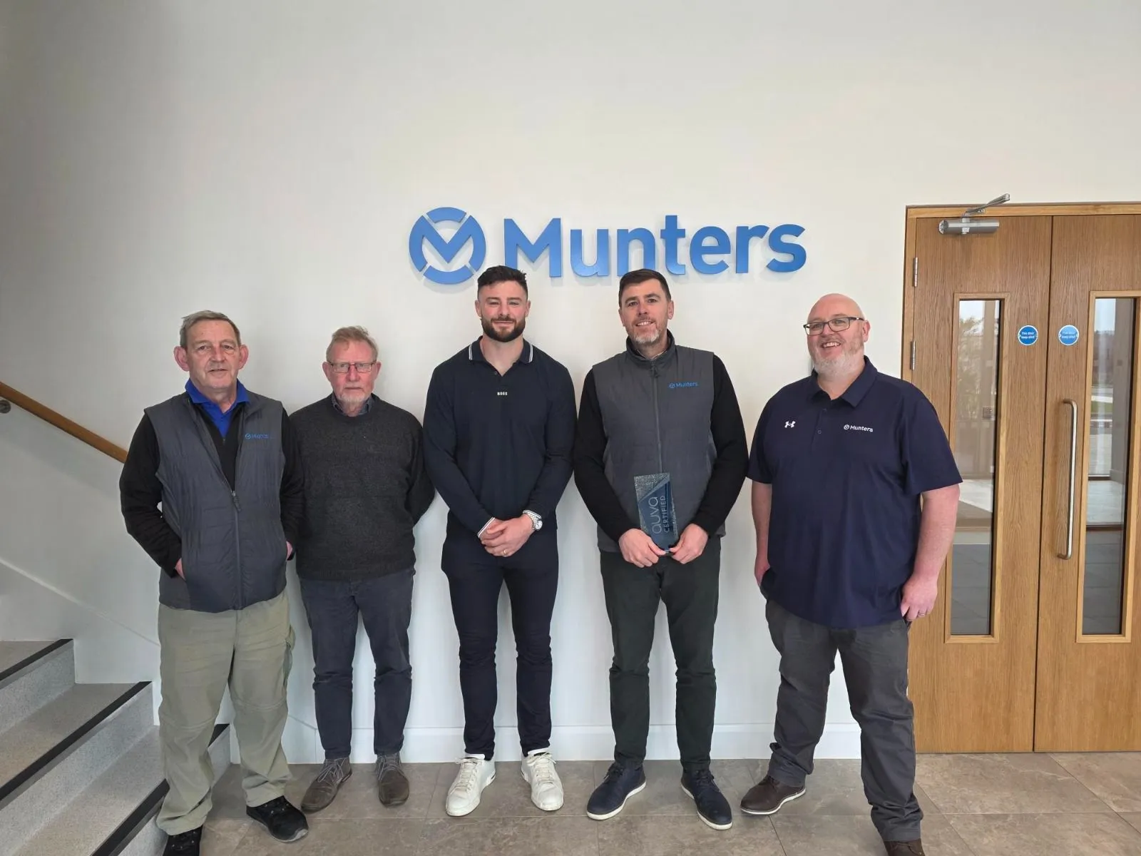 Munters receiving ISO 45001 Occupational Health & Safety Certification certification from Paula Brady